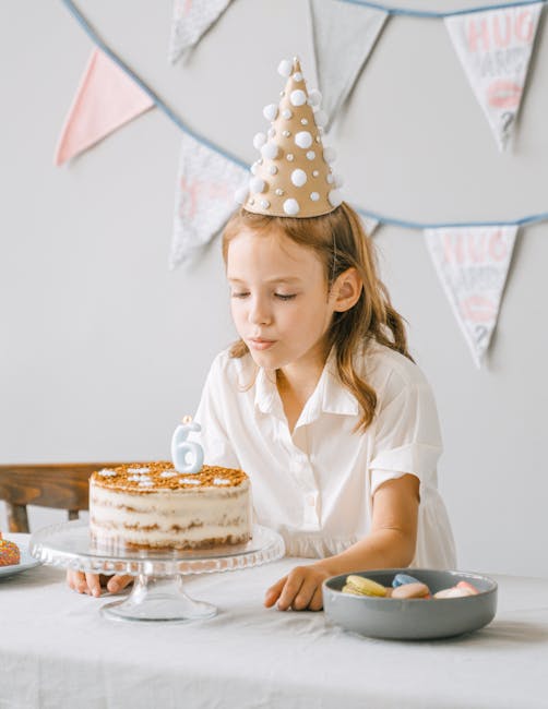Child blowing birthday candles representing milestones
